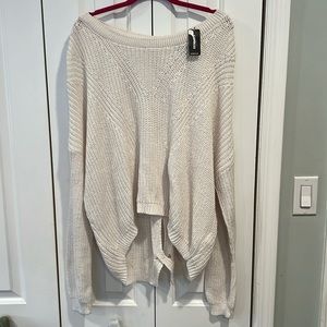 Express knit off-white sweater. Hi-lo with cut out design on back. Sz L NWT